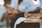 Close-up of writing hands of uniform students to exam or test in classroom  at school