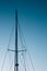 Close-up of yacht masts against the blue sky. Marine theme