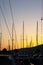 Close-up of yacht masts against the sunset sky. Marine theme