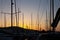 Close-up of yacht masts against the sunset sky. Marine theme