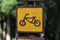 Close up yellow and brown bike on Wood banner sign