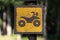 Close up yellow and brown motorcycle on Wood banner sign