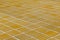 Close-up of yellow glazed tile floor/wall