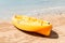 Close-up of a yellow kayak at the water`s edge