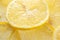 Close-up yellow lemon cross section slices with selection focus. Fresh juicy