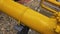 Close-up yellow pipe, industrial machine