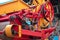 Close-up of the yellow and red combine harvesters