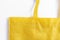Close-up, Yellow reusable fabric bag, on white background