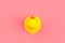 Close up of yellow rubber duck isolated. Bath toys on a pink background. Top view with copy space.
