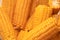 Close up yellow sweet corn grain, dense rows of boiled yellow corn seeds for background. Macro