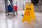 Close-up Of Yellow Wet Floor Caution Sign