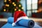 Close up of yoga mat with Santa Clause hat with home decorated for Christmas, New Year. Healthy lifestyle, weight