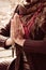 Close up of yoga woman hands in namaste gesture  with henna drowing on hands outdoor shot