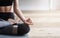 Close up of yoga woman sitting in lotus asana