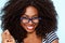 Close up young african american woman with curly hair wearing glasses