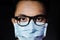 Close up of young asian man wearing hygienic mask and glasses