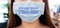 Close up of young Asian woman wearing protective face mask writing please wear a face mask. Campaign to encourage wearing masks