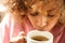 Close up young black woman drinking cup of tea