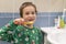 Close-up of young boy brushing teeth with toothbrush Portrait of healthy little boy enjoy cleaning his teeth with a happy face,