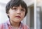 Close up  young boy crying, Head shot of Kid with sad face, Emotional portrait of lonely child with unhappy face, Bored 5 years