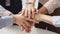 Close up of young business people putting their hands together. Stack of hands. Unity, particication, teamwork, support, and