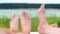 Close up of young couple feet relaxing on beach. Woman. Man. Lake. Landscape. Legs.