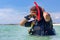 Close up young dutch diver stands in sea