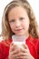 Close up of young girl drinking milk.