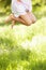 Close Up Of Young Girl Jumping In Summer Field