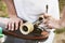 A close-up of a young guy changes his wheels on his longboard and adjusts the suspension.