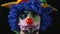 Close-up of young hilarious clown making funny faces