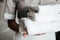 Close up of a young maid holding folded towels