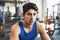 A close up of a young man in crossfit gym, resting after an exercise.