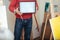 Close up of young man demonstrating a painters diploma