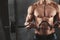 Close up of young muscular man lifting weights