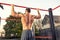 Close up of young muscular mans torso while he is doing pull ups taken from the back, close up of back muscles