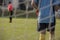 Close up of a young soccer goalie goalkeeper during the match.