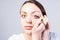 Close up Young Woman Applying Eyeliner Makeup