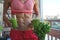 Close up of young woman with blender and green vegetables making detox shake or smoothie at home