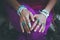 Close up of young woman hands with boho accessories rings and br