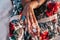 Close up of young woman hands with stylish gem stone rings and accessories