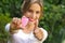 Close up of a young woman pointing in front of her a menstrual cup in one hand, Gynecology concept, ith her thums up