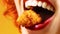 Close up of young woman putting chicken nugget in her mouth. Traditional American cuisine dish