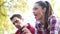 Close-up of young woman singing and man playing guitar