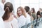 close up. young woman sitting in a row with her associates.