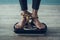 Close up. Young Woman Standing on Weigher on Floor