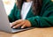 Close up Young woman using laptop at table