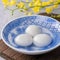 Close up of yuanxiao tangyuan in a bowl on gray table, food for Chinese Lantern Yuanxiao Festival