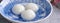 Close up of yuanxiao tangyuan in a bowl on gray table, food for Chinese Lantern Yuanxiao Festival