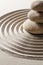 Close-up on zen pebbles with sand background